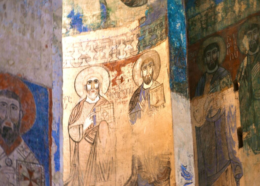 Ancient Christian fresco depicting saints with halos, symbolizing the quiet faith of All Saints’ Day and the call to protect the Imago Dei within the Creative Calling.
