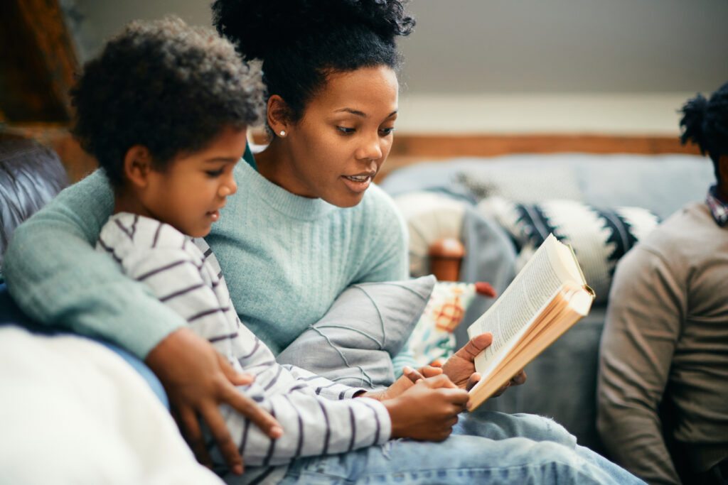 Mother reading aloud with child—Ministry of Elimination homeschool focus on simple, peaceful learning at home.