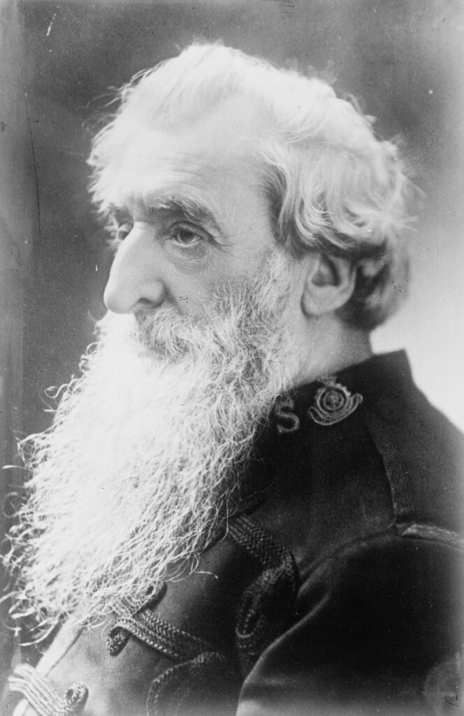 William Booth, founder of the Salvation Army, shown in an old black-and-white portrait with a long beard and uniform.