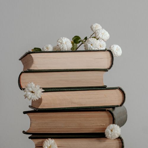 A stack of books symbolizing peaceful homeschool priorities and a gentle, ordered approach to learning